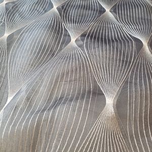 Grey sheer fabric with geometric white thread